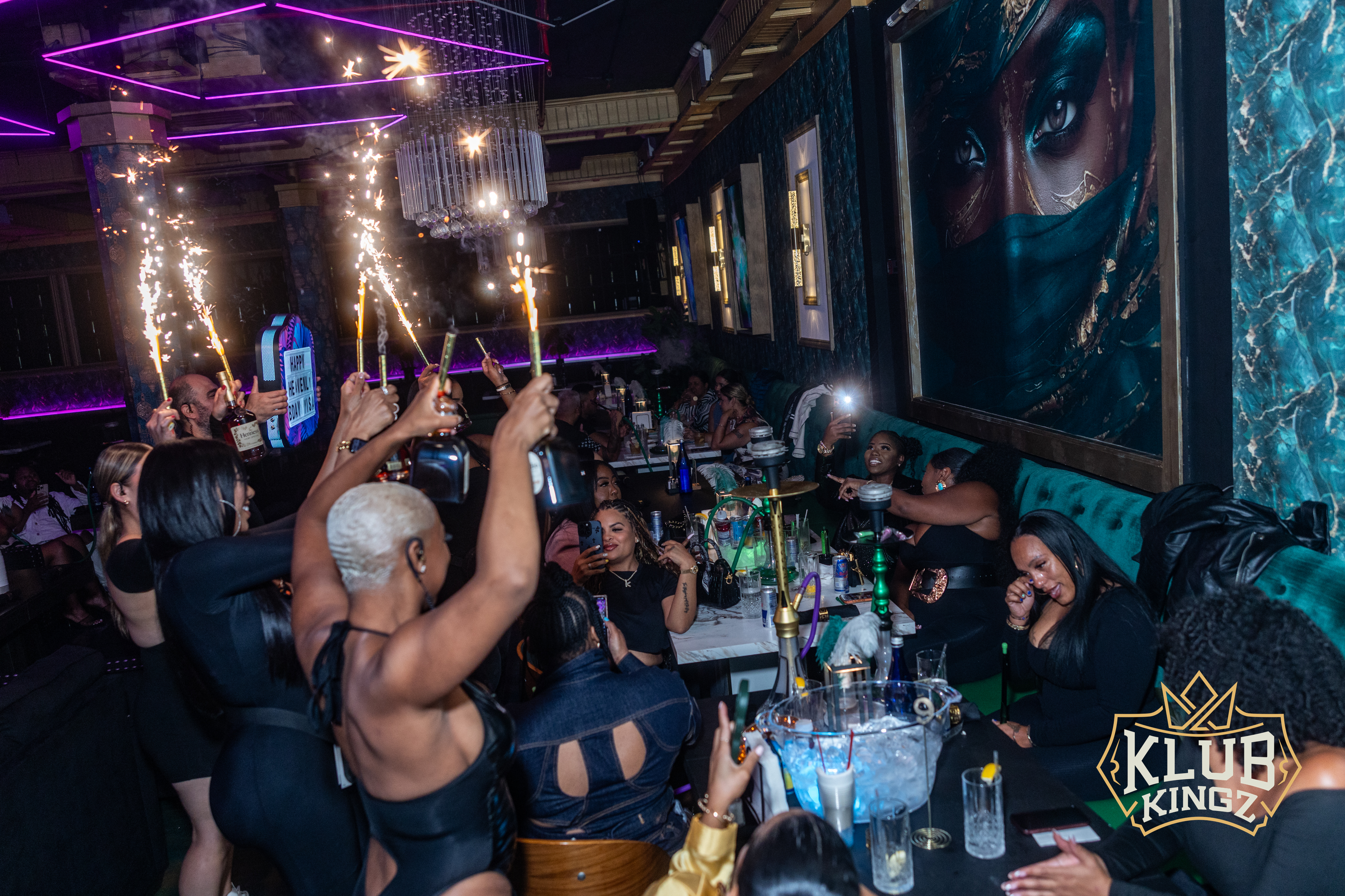 Guests celebrate with sparkler bottle service and hookah lounge vibes at Klub Kingz nightclub