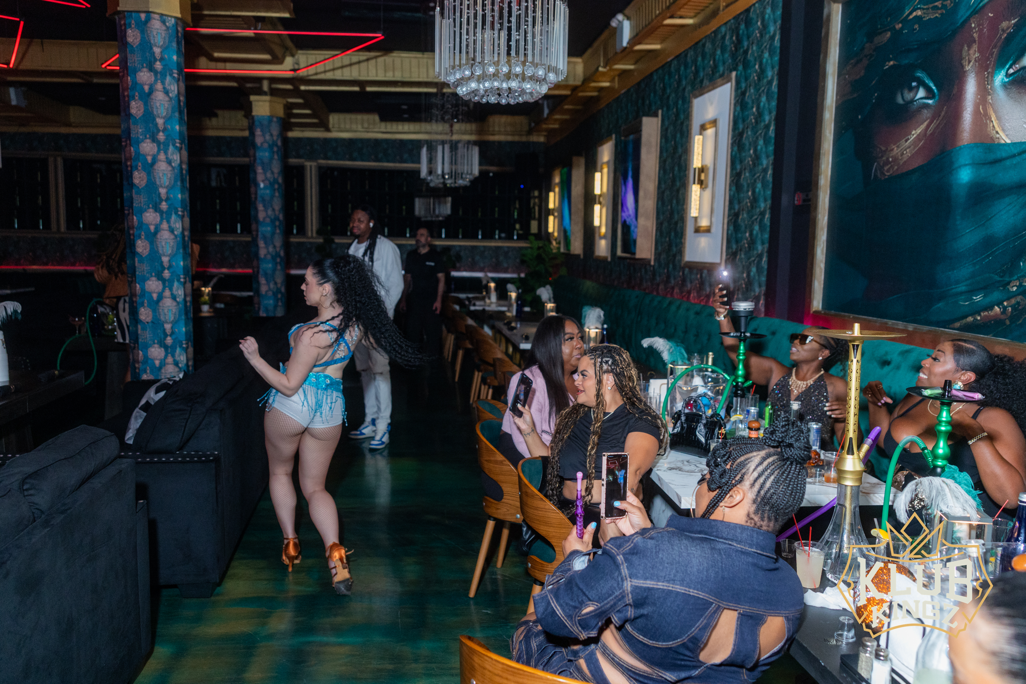 Guests enjoying hookah and nightlife entertainment at Klub Kingz lounge with vibrant decor