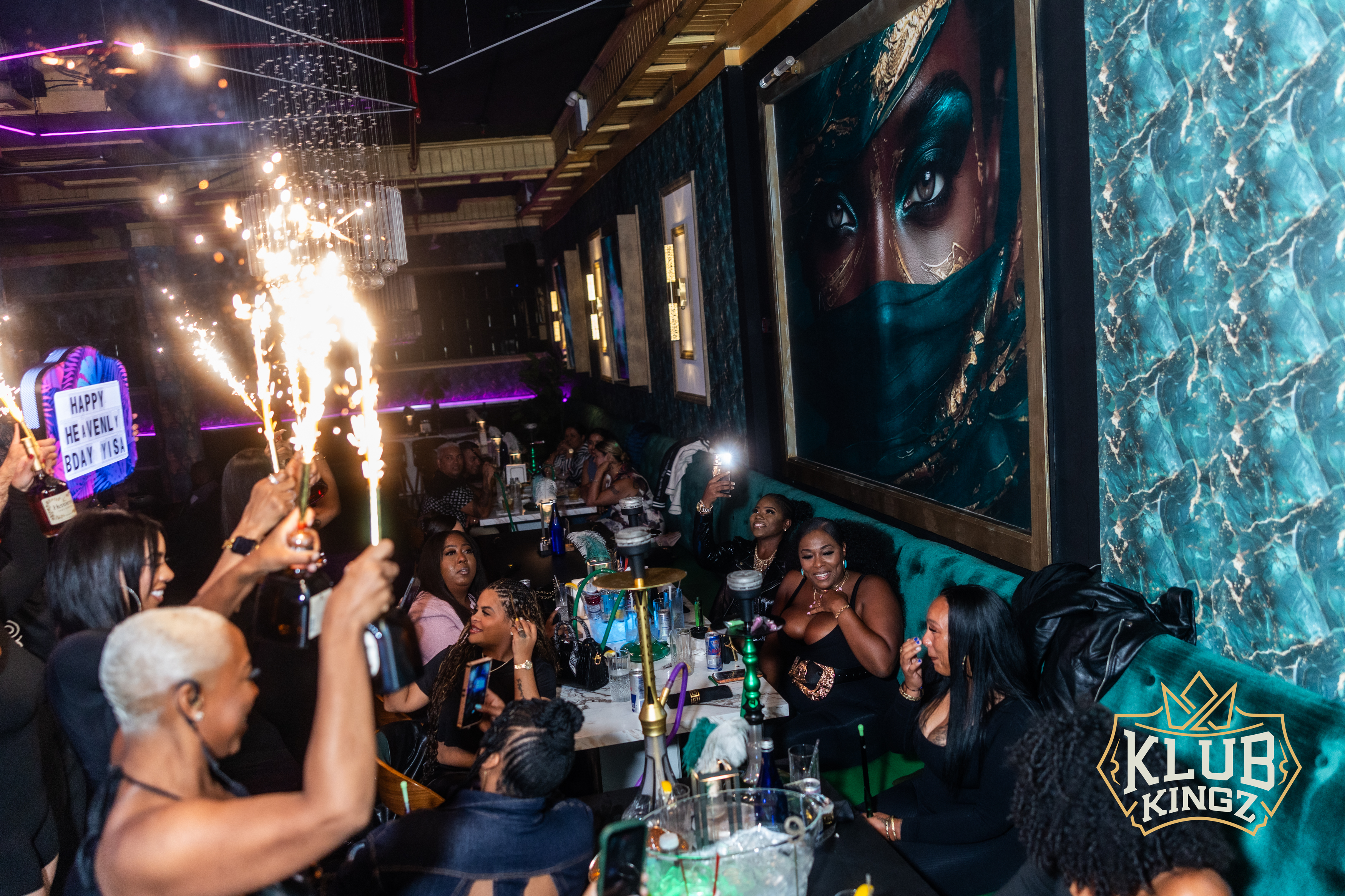 Guests celebrate a birthday with sparkler bottle service at Klub Kingz nightclub lounge