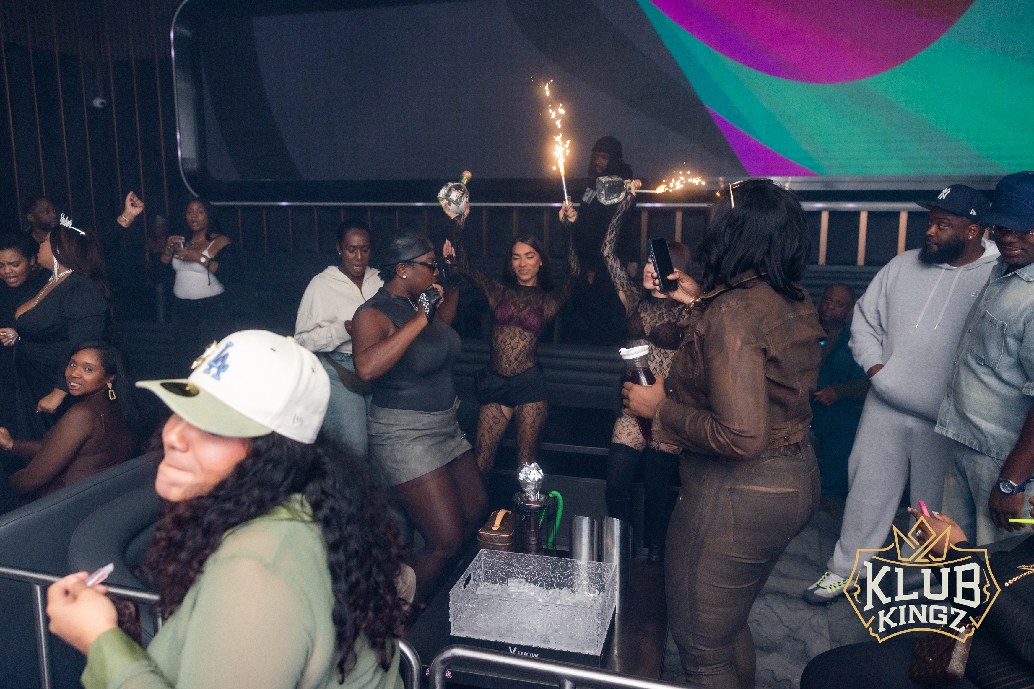 Guests celebrating with sparkler bottle service on the dance floor at Klub Kingz nightclub