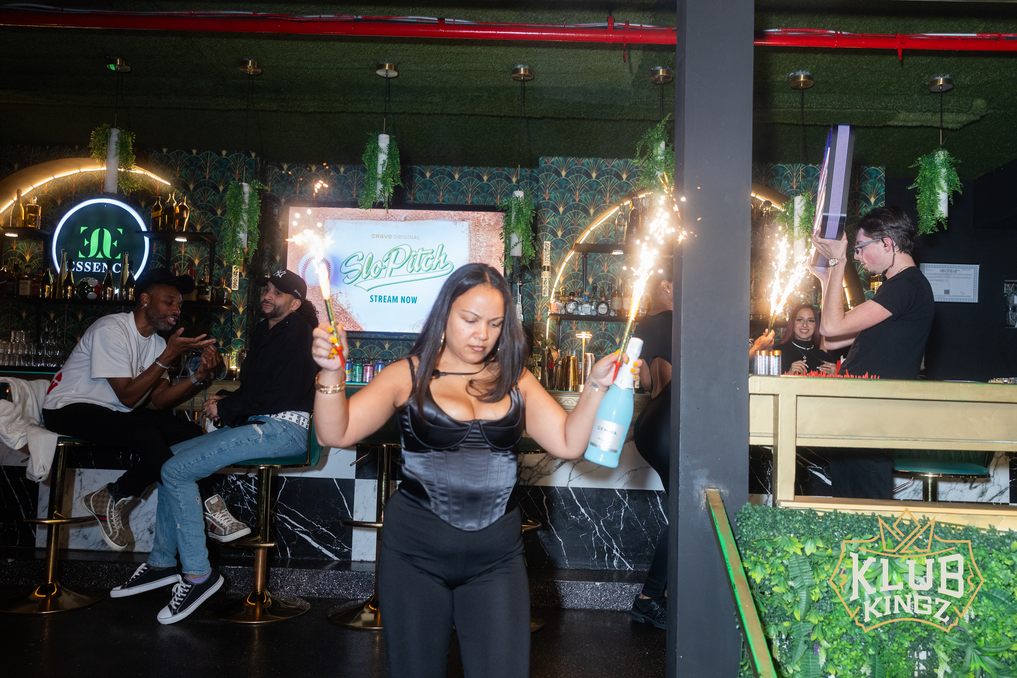 Bottle service sparklers light up the bar at Klub Kingz nightclub during a lively night out