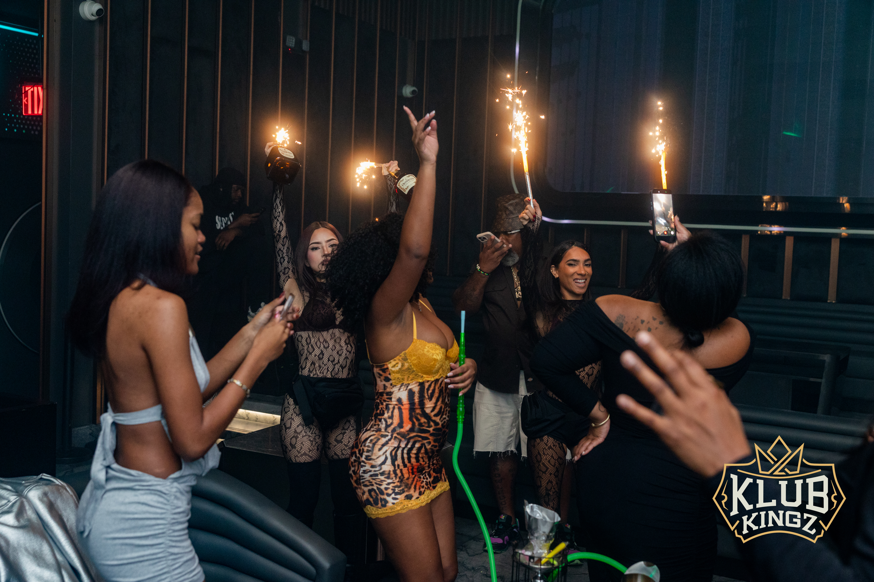 Guests celebrate with sparkler bottle service and hookah at Klub Kingz nightclub party
