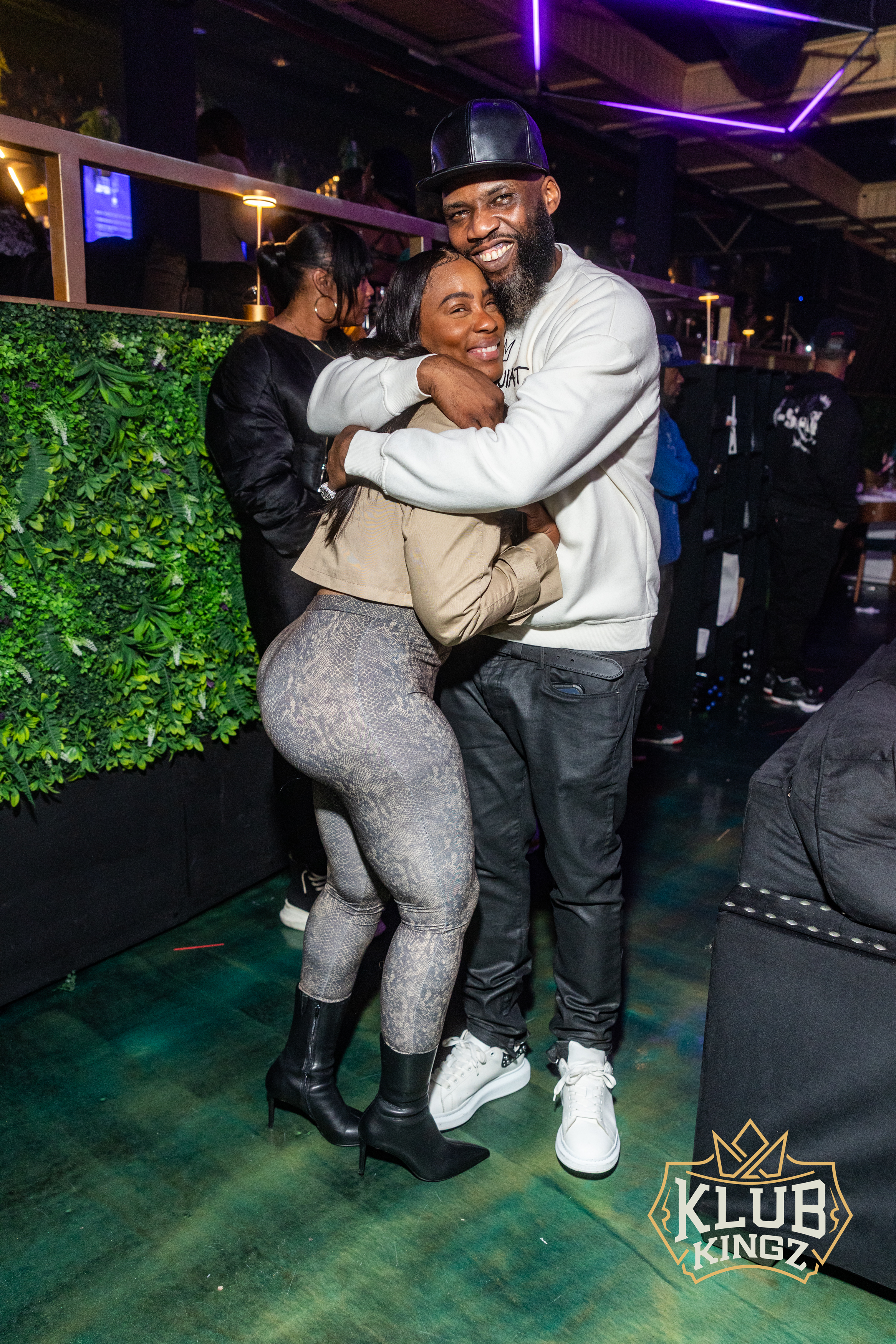 Smiling couple hugging on the dance floor at Klub Kingz nightlife event