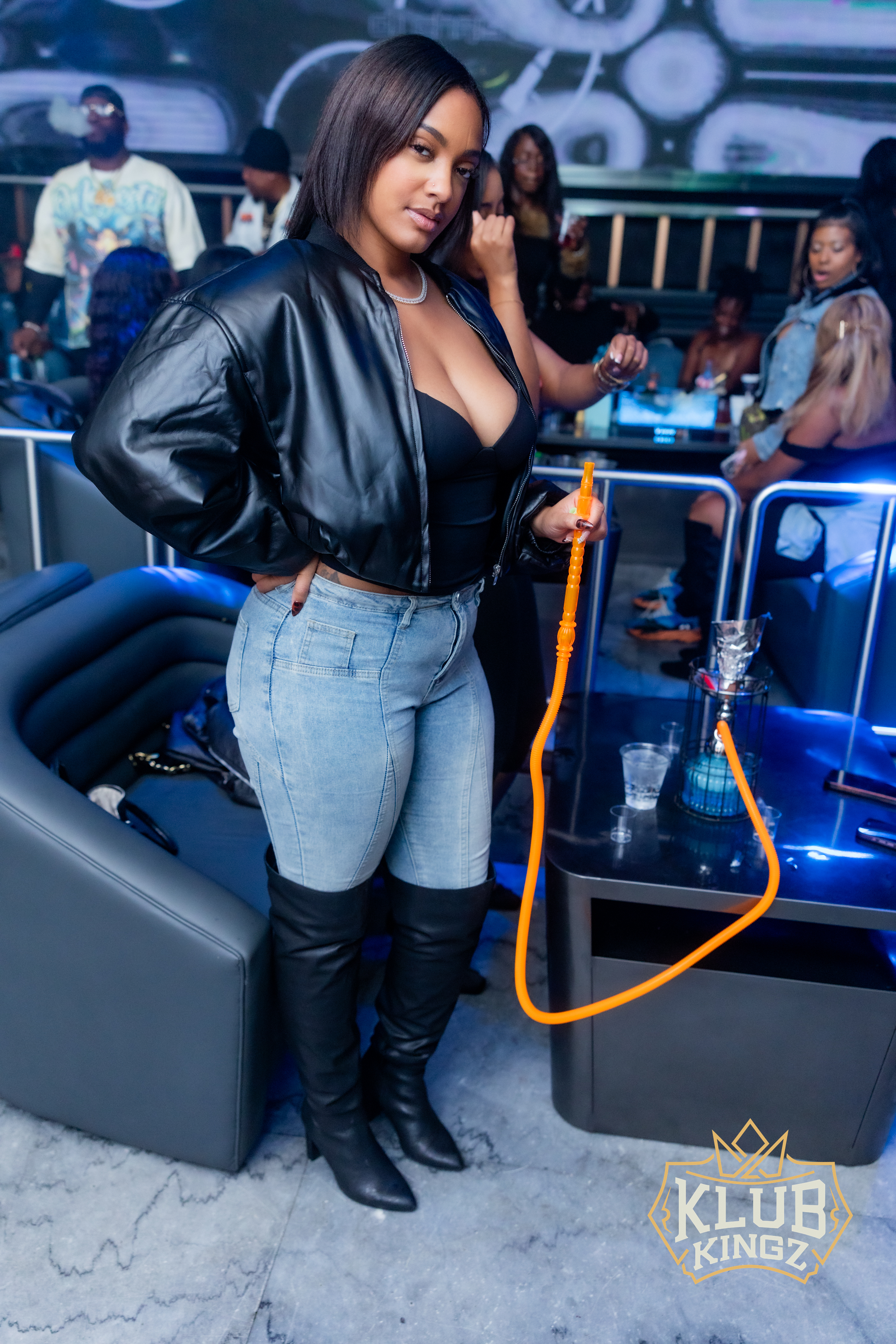 Stylish guest enjoying hookah lounge nightlife at Klub Kingz